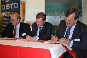 CSIRO chief of animal, food and health sciences Professor Martin Cole, UTAS vice-chancellor Peter Rathjen and DSTO’s chief defence scientist Dr Alex Zelinsky sign the collaborative agreement.